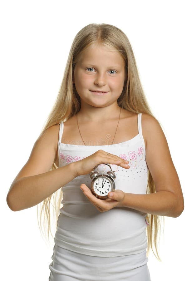 The Girl Holds An Alarm Clock In Hands Stock Photo Image of girls