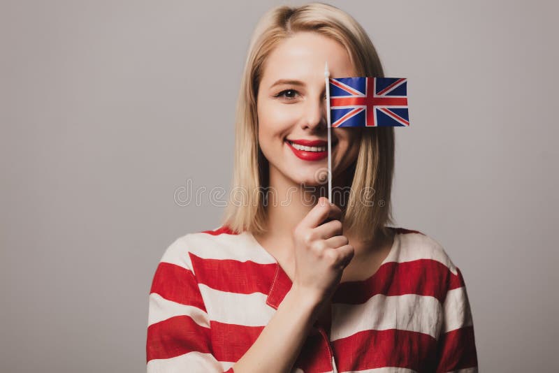 Girl Holds British Flag On Gray Background Stock Photo - Image of ...