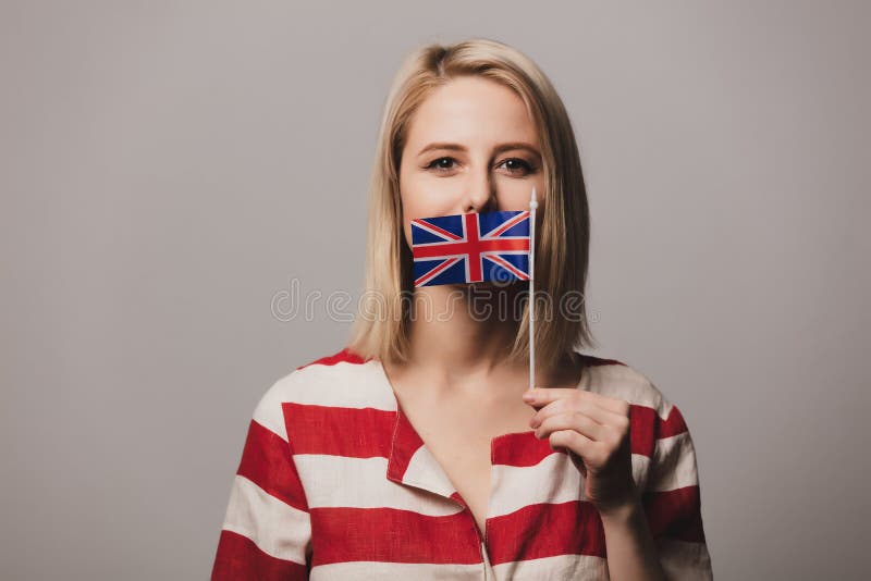 Girl Holds British Flag on Gray Background Stock Photo - Image of ...