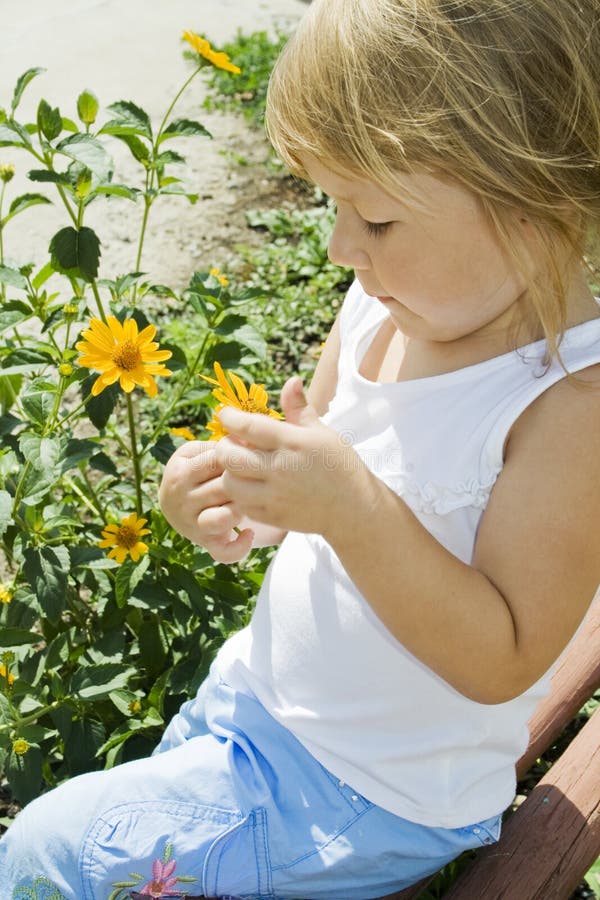 Girl holds flower