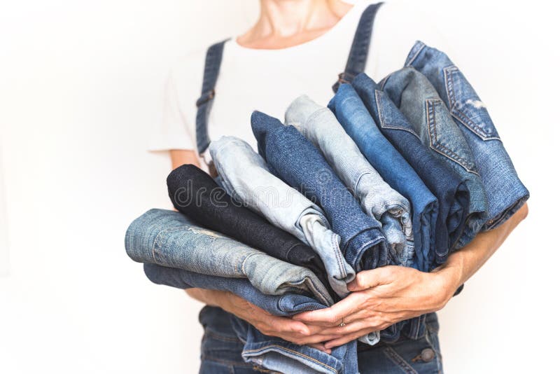 Jeans in her hands stock image. Image of cleaning, clothing - 124039471