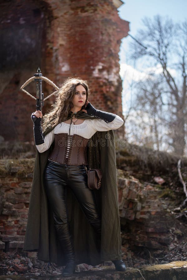 Girl hunter with a crossbow on the ruins stock photo Girl hunter with a crossbow on the ruins stock photo