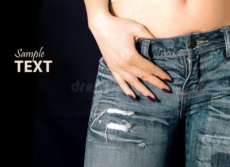 Girl in jeans with hand over strap. Button clasp stock images, royalty-free photos and pictures