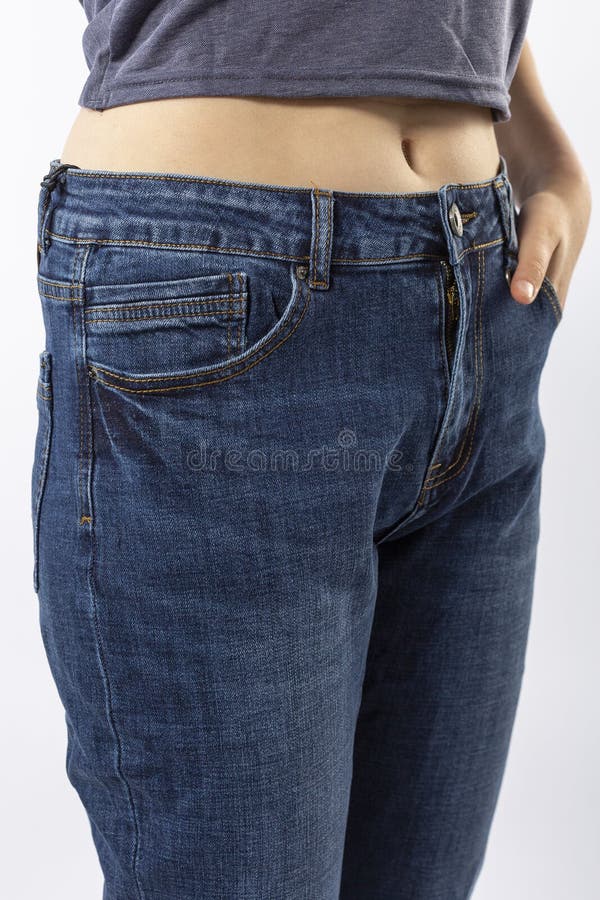 Girl in Jeans Shows Off Jeans on White Background Close Up Stock Image ...
