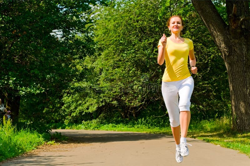 Girl jogging stock photo. Image of white, caucasian, green 20154796