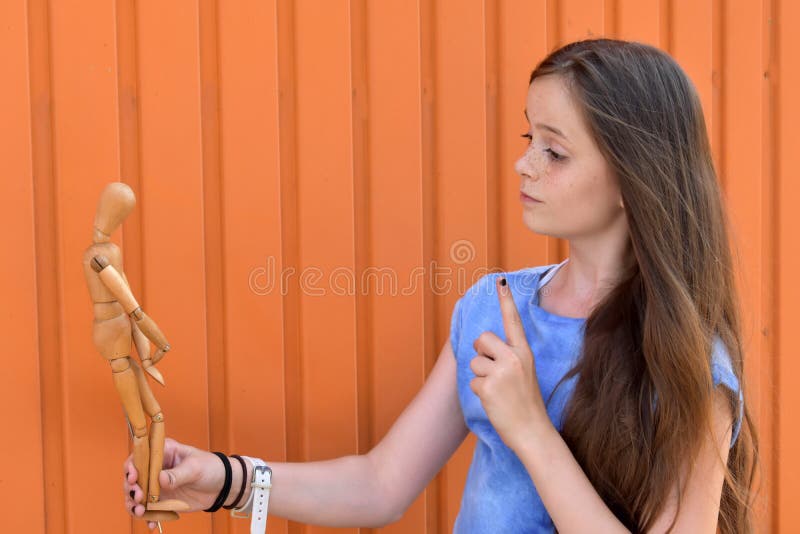 Girl and jointed doll