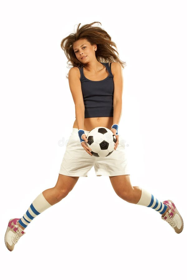 Girl jumpig with soccer ball