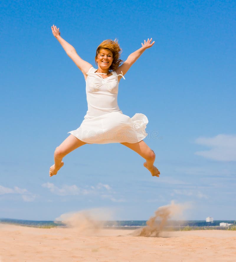 Girl jumping stock photo. Image of ocean, celebration - 8784828