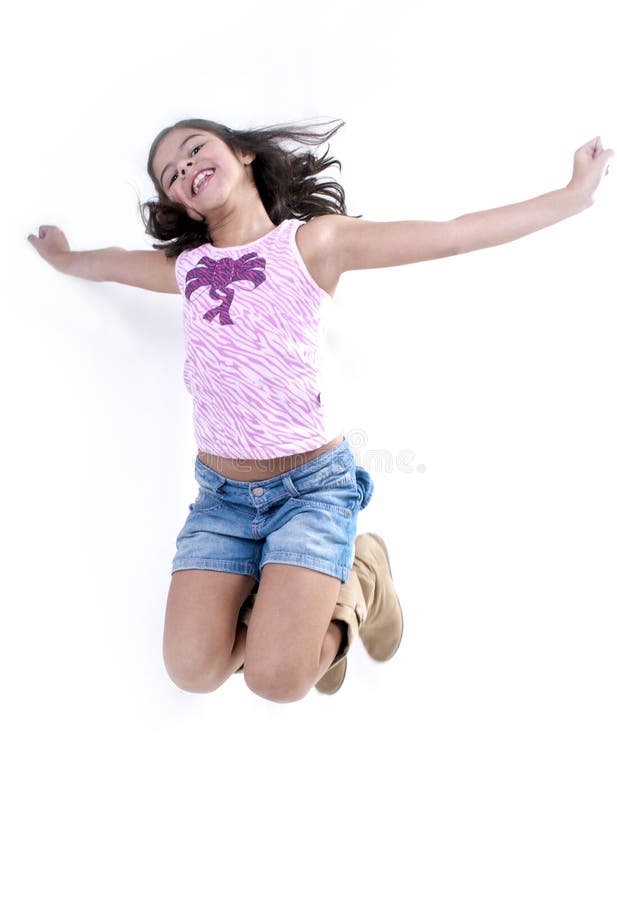 Girl jumping for joy. Cute young hispanic girl jumping for joy with outstretched arms; isolated on white background stock photos Girl jumping for joy. Cute young hispanic girl jumping for joy with outstretched arms; isolated on white background stock photos