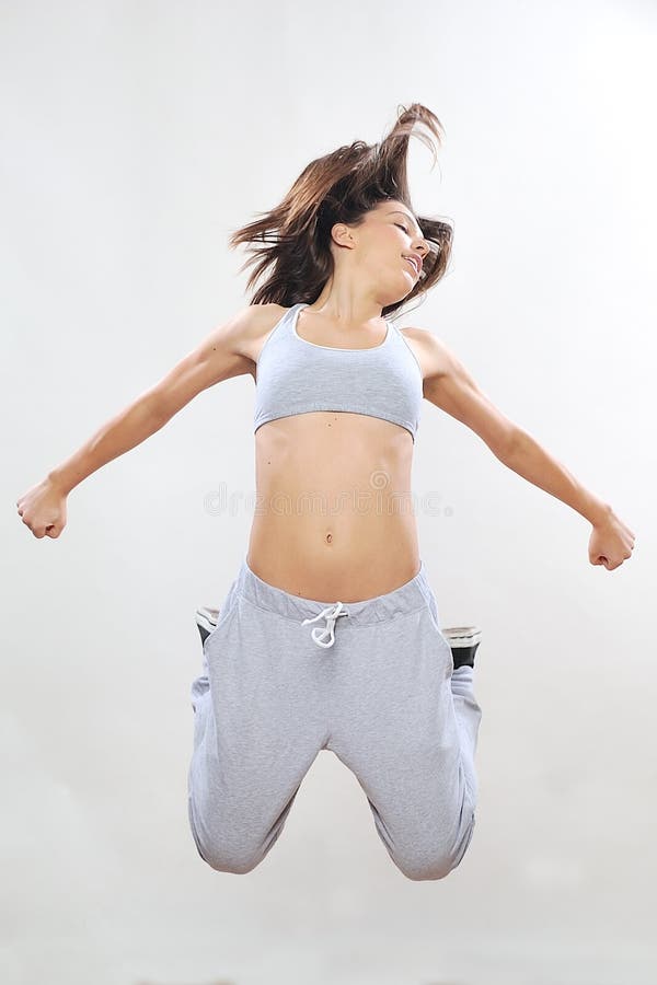 Girl jumping in studio