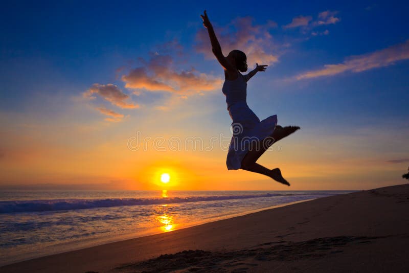 Girl jumping in the sunset