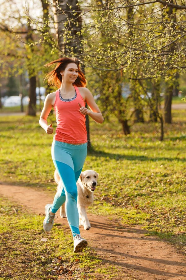 Girl with labrador in park stock image. Image of coach 92747345