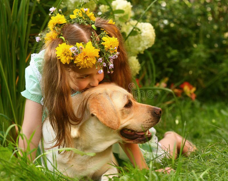 Girl and a labrador retriever.