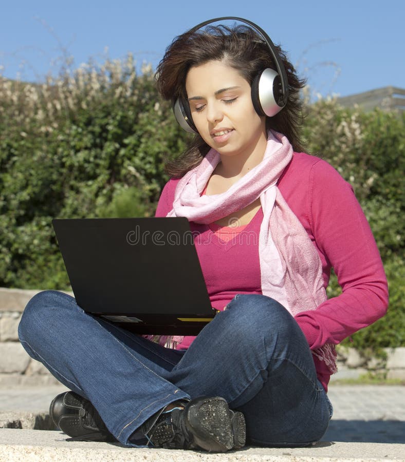 Girl with a laptop and headphones