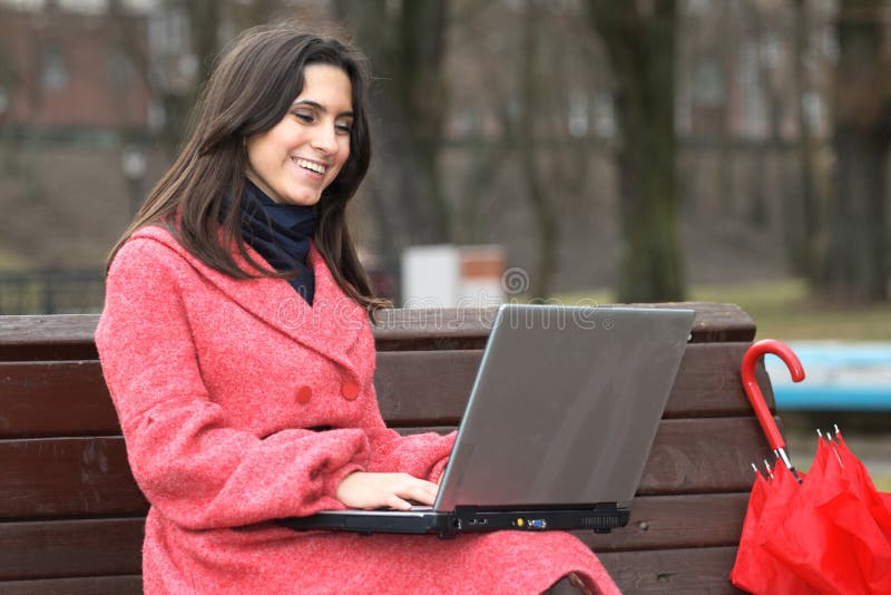 The girl laptop in park