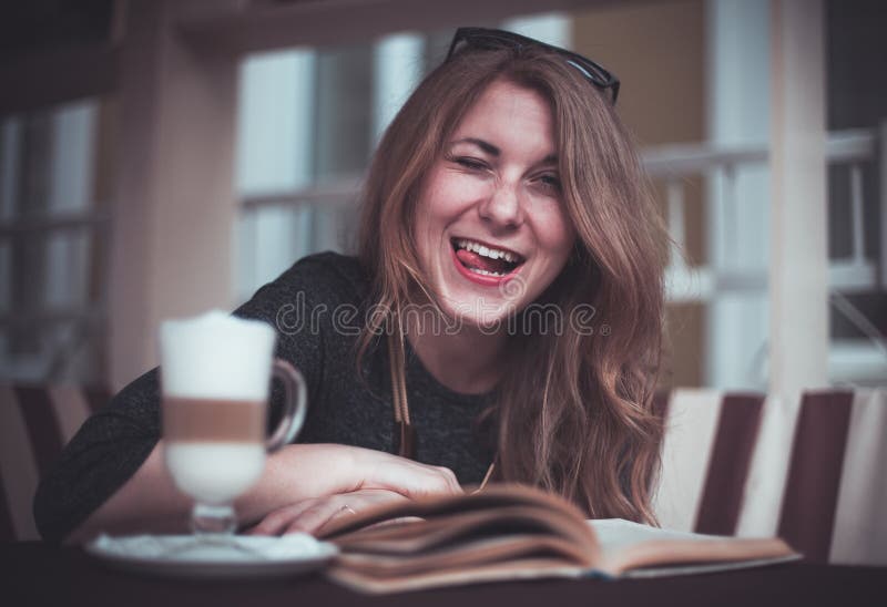 Cup with latte and a book stock image. Image of cacao - 69823865