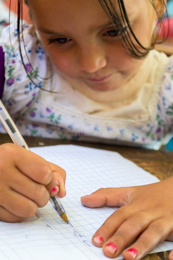Girl learning to write stock photo Girl learning to write stock photo