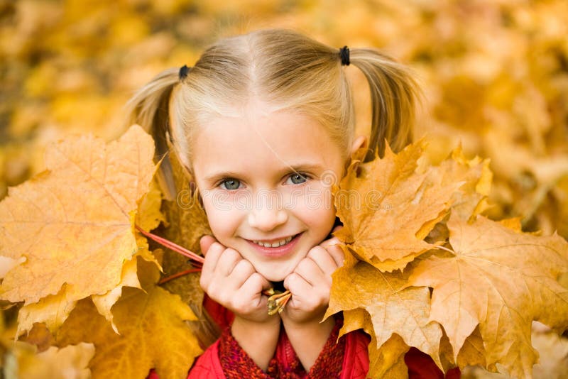 Girl with leaves stock photo. Image of childhood, maple - 10310354
