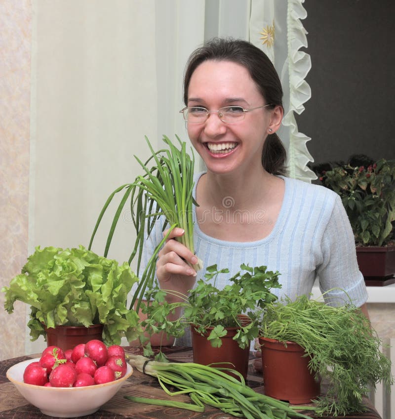 Girl with leaves of salad