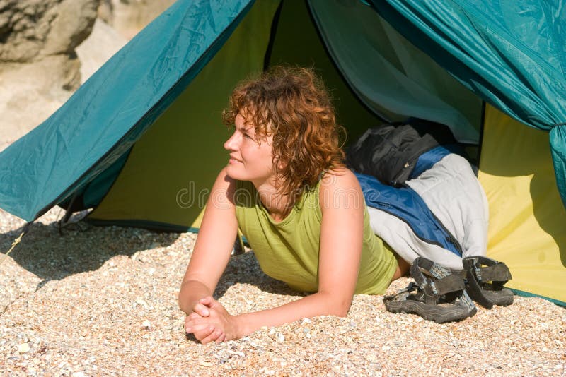 Girl lie near of tent