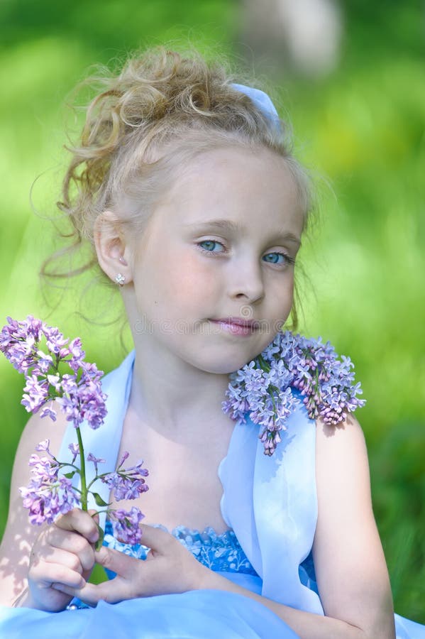 Girl with lilac stock photo. Image of garden, flowers - 20505868