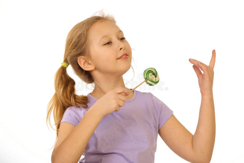 Girl with lollipop on a white background