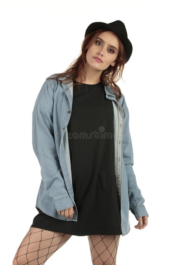 Attractive grunge, rock punk girl in a long oversized black t-shirt dress with a blank space ready for your design