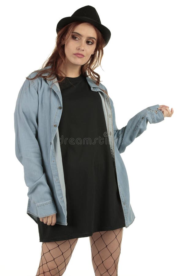 Attractive grunge, rock punk girl in a long oversized black t-shirt dress with a blank space ready for your design