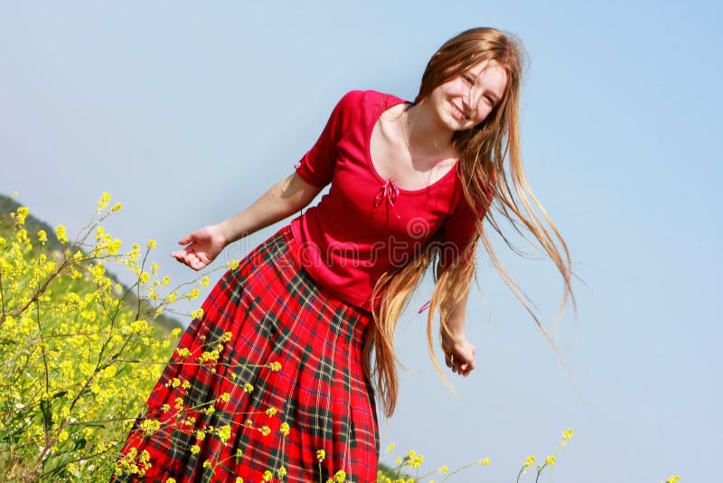 Girl with long hair in yellow flowers