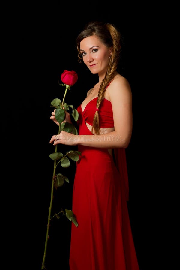 Girl in a long red dress with red flower