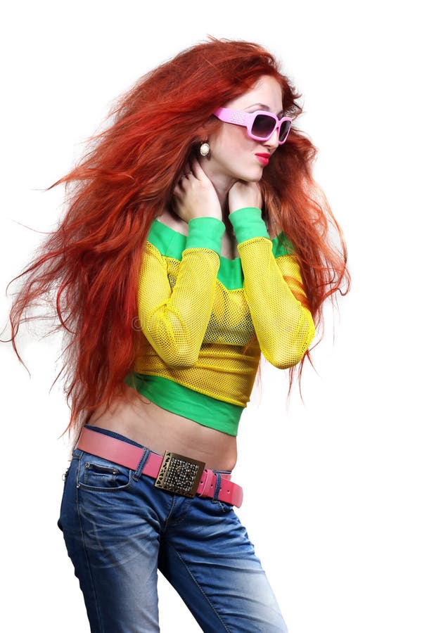 Girl with long red hair in fashion sunglasses