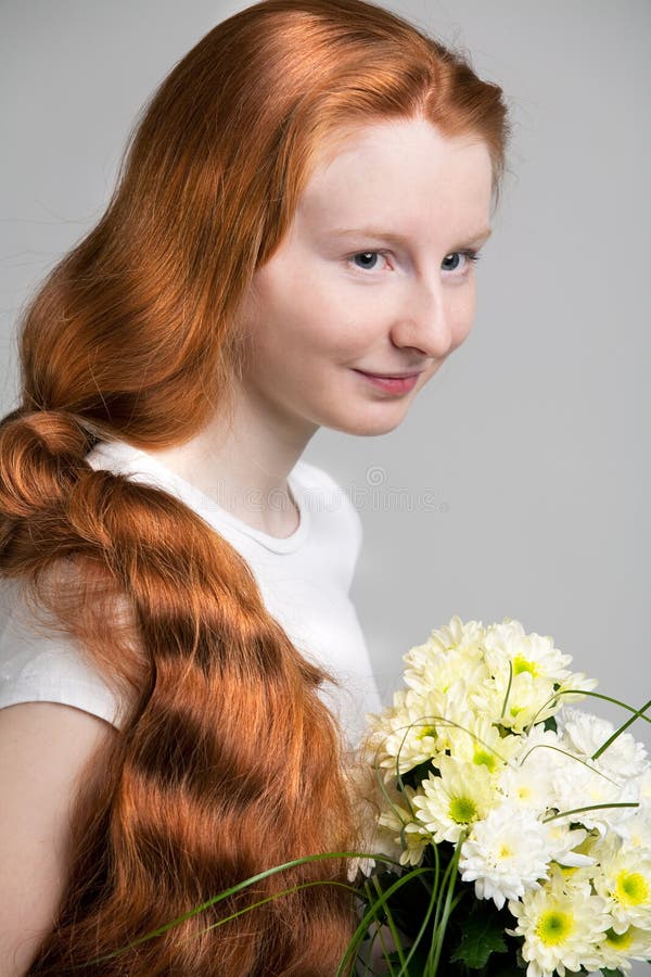 Girl with long shining red hair