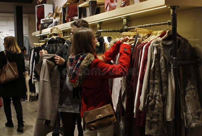 Girl Looking at Jackets in a Clothing Store Editorial Stock Photo ...