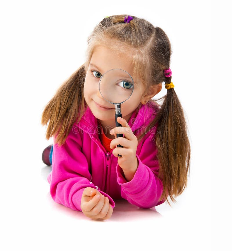 Girl looking through a magnifying glass