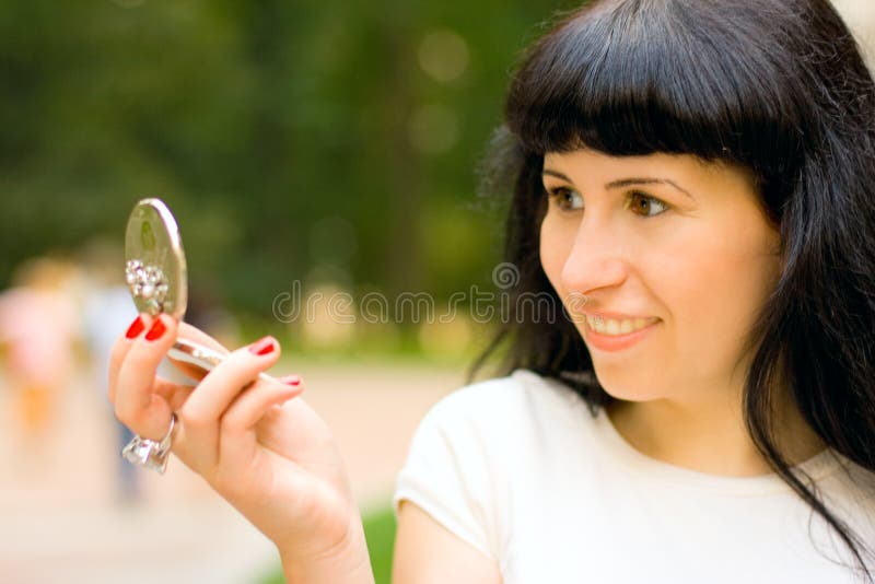 Girl looking in the mirror