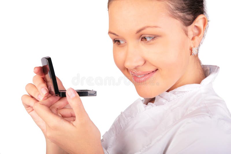 girl looks in small mirror stock photos