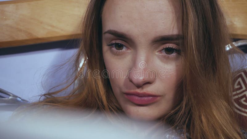 Girl looks to the monitor and drinks tea