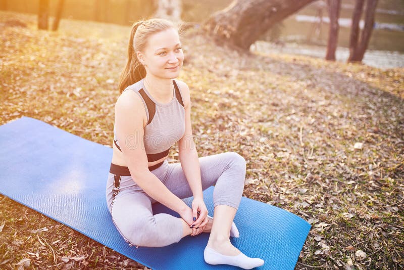 Girl In Cat Pose On Yoga Mat In The Park Stock Image Image Of