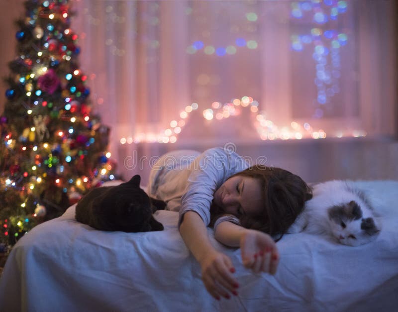 The girl is lying on the bed with the seals