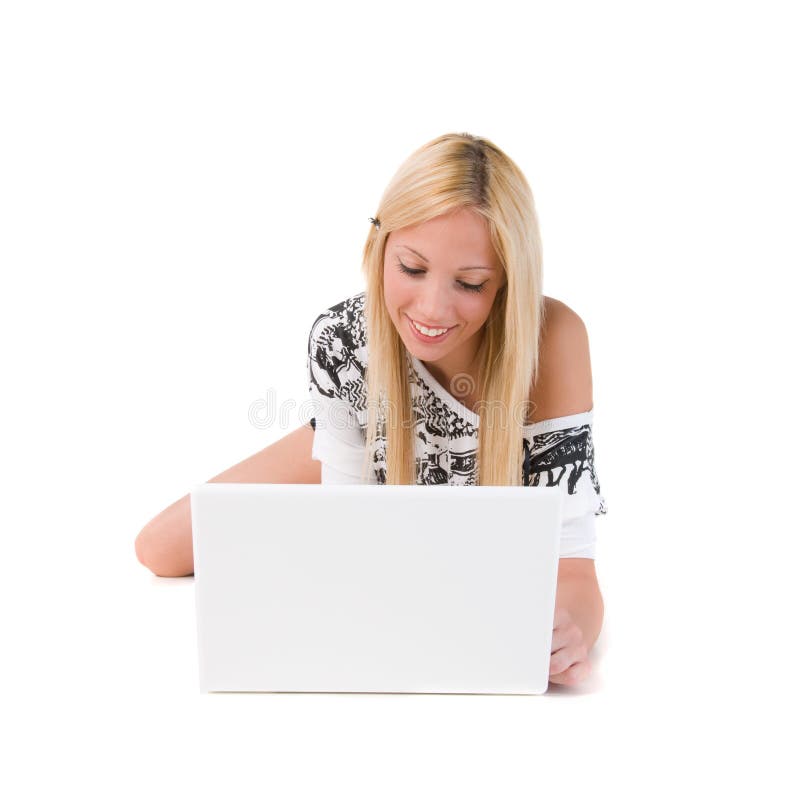 Girl lying on floor using laptop