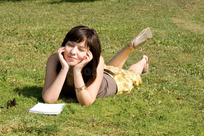 Girl lying on grass