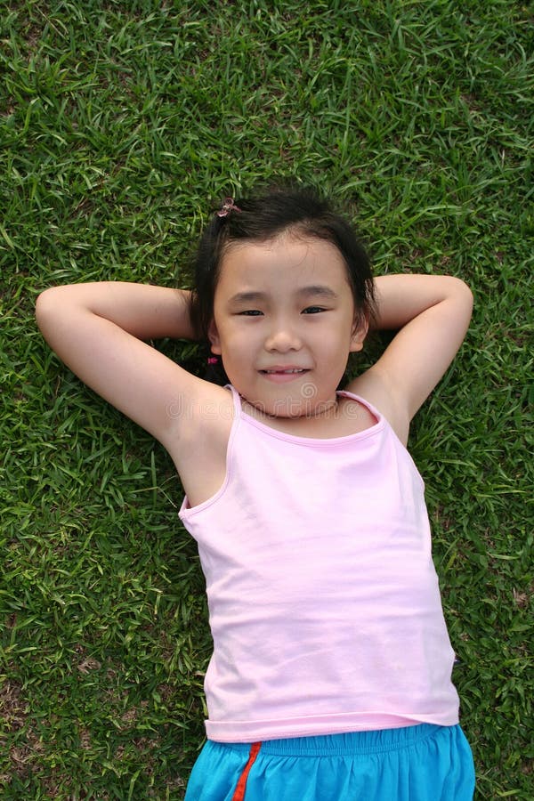 Girl lying on the grass