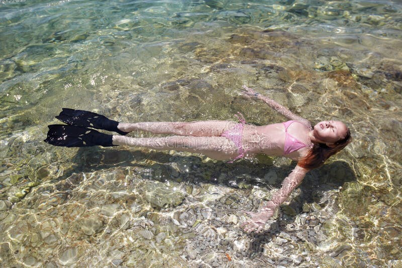 Girl lying in sea