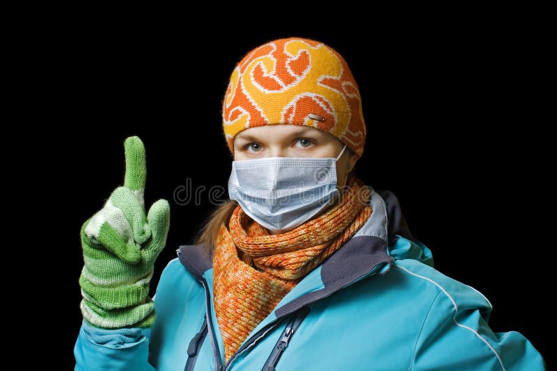 Girl in a mask to protect against influenza