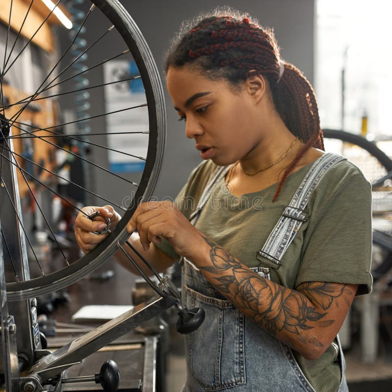 Female Master Fixing Bike Tube in Bicycle Workshop Stock Photo - Image of mechanic, bicycle: 248318550