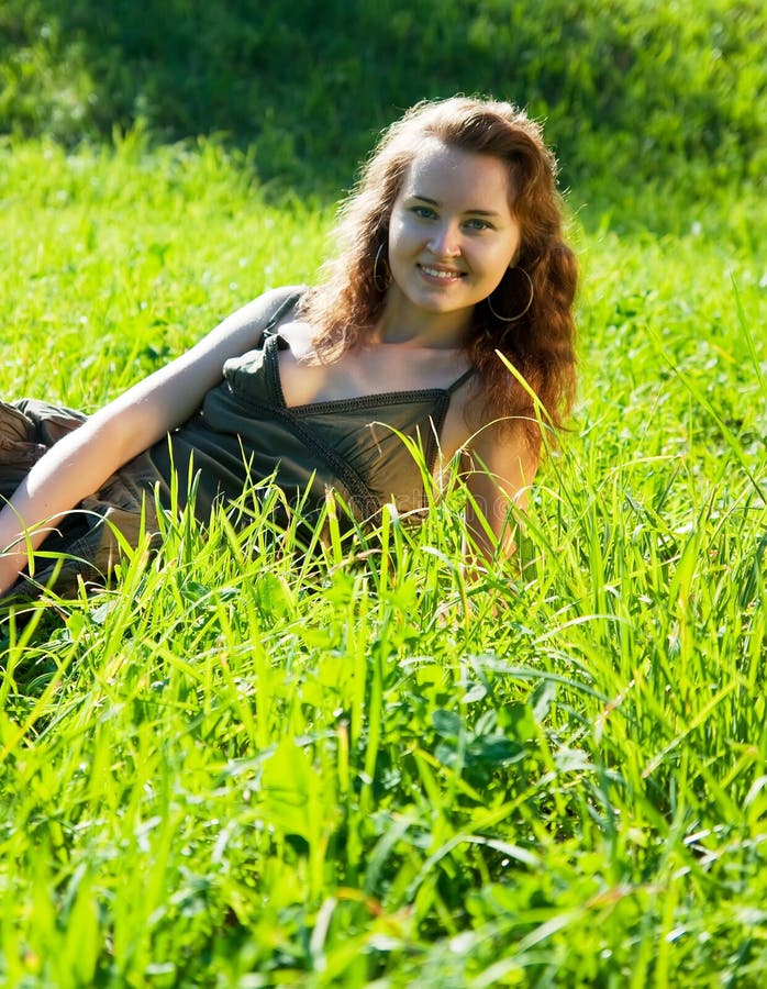 Girl on meadow grass