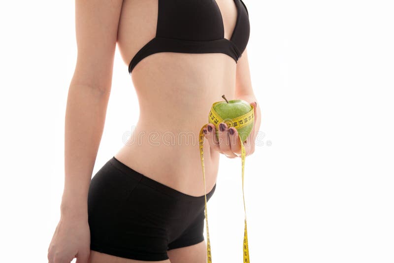 The girl measures the waist royalty free stock images