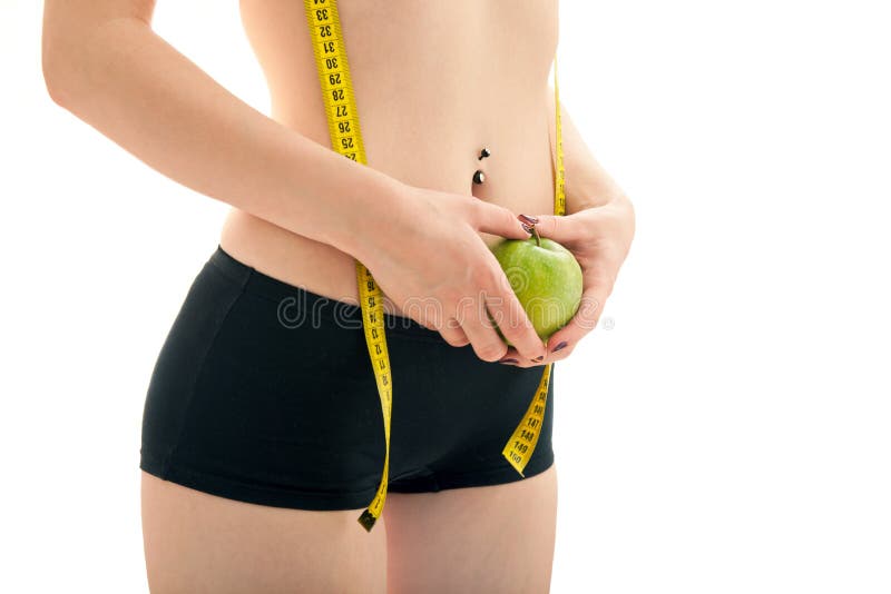 The girl measures the waist stock images