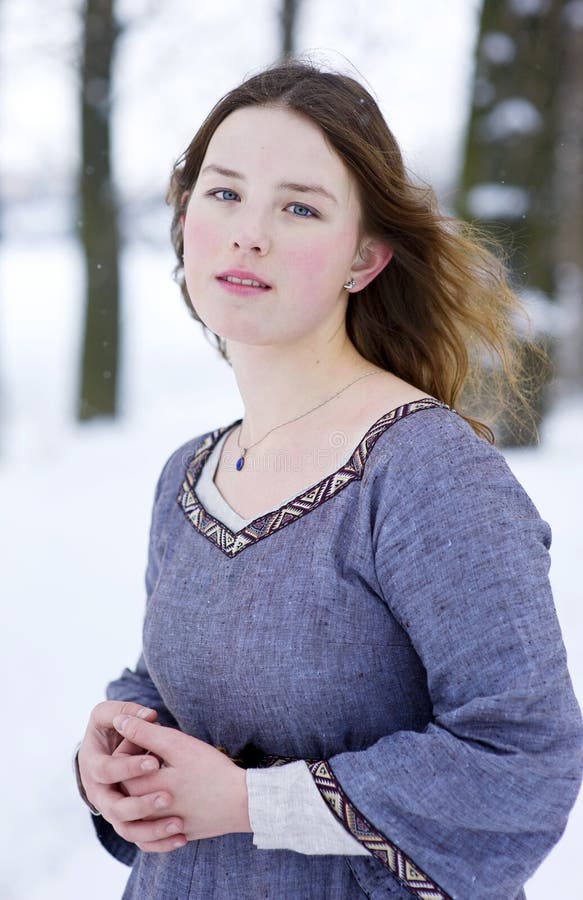 Girl in medieval dress in winter