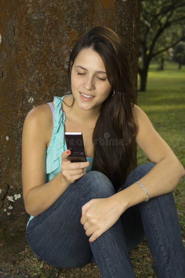 Girl messaging with cellphone